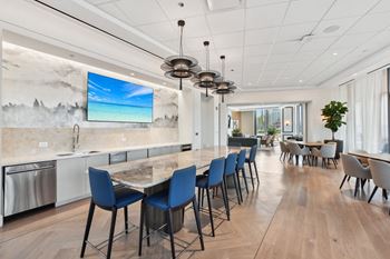 a large kitchen and dining room with a long table and chairs  at Cassidy on Canal, Chicago, Illinois